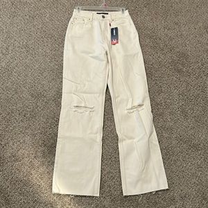 used denim cream jeans